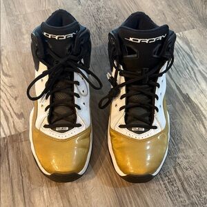 Jordan High-Top Sneakers in Black, White, and Gold